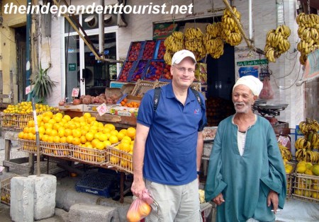Purchasing some fruits from a street vendor (great oranges!).