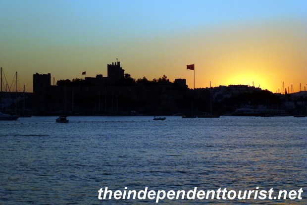 The sun sets over St. Peter's castle in Bodrum.