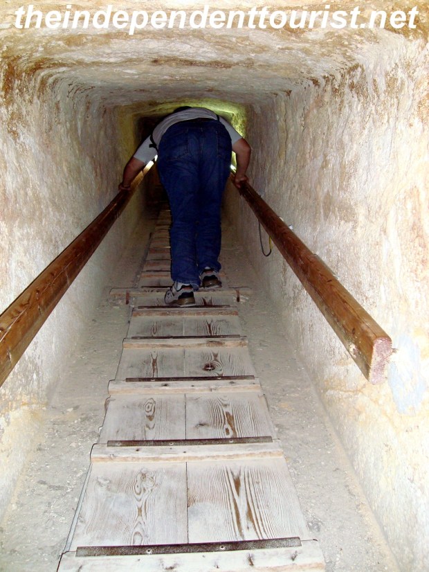 Climbing out of the Queen's Pyramid, giving an idea of what the access tunnels are like.