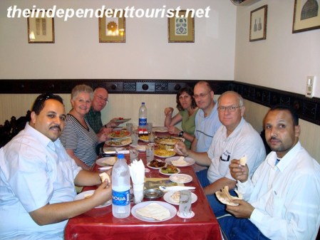 Eating dinner with our driver (on left) and his colleague after a day of touring Cairo.