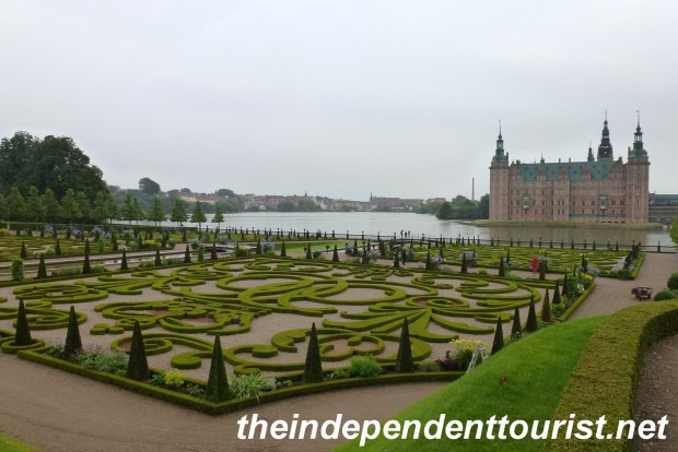A view of Fredriksborg castle, lake and gardens.