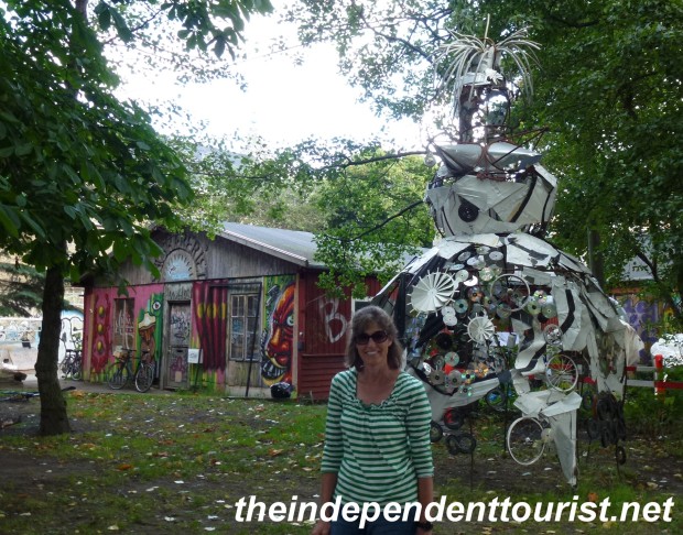 Robyn stands by a creative sculpture in Christiania.