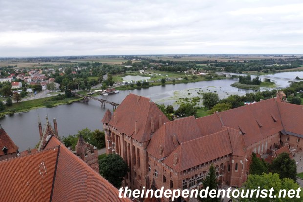 A view taken from the Main Tower of the High Castle, overlooking the Palace of the Grand Masters, Middle Castle and the Nogat River.