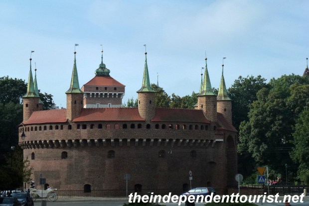 The Barbican, one of the few surviving structures of its kind in Europe. It was built around 1498. It has seven turrets, 130 loopholes (for firing arrows) and the walls are 3 meters thick. It helped defend the Florian Gate, which is part of the remaining defenses on the north side of Kraków's old town.