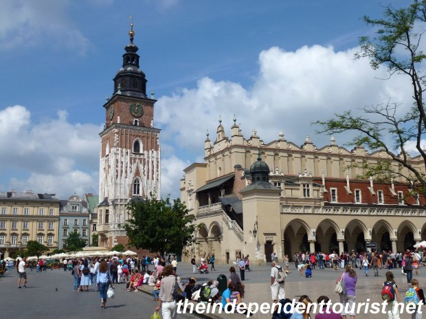 The tower on the left is the only remaining part of the 15th century Town Hall. On the right is the Cloth Hall, both are in the central part of Rynek Square.