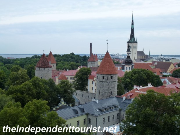 View of Tallinn's walls and towers from Toompea Hill. St. Olav's Church has the tall spire on the right.