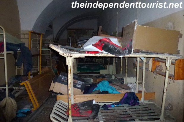 One of the cell blocks with a lot of left over clothes and other items.