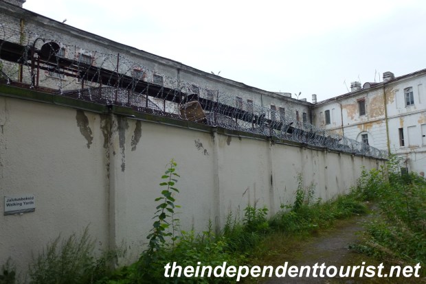 This is the courtyard and up until World War II the prisoners could walk in open space here. After the start of the Soviet occupation, the open-roof cells to the left were built. Prisoners would be crammed in these small "boxes" for an hour of fresh air.