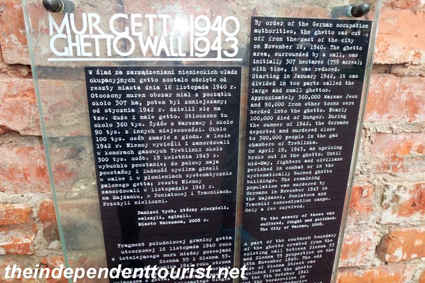Information about the Warsaw Ghetto is posted on the wall.