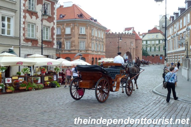A horse-drawn carriage on a street in Old Town Warsaw.